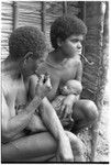 The kwai'okoa'i birth helper and baby sit with Lamana of nearby Maaburu