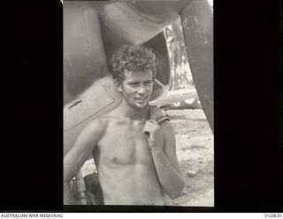 MOMOTE, LOS NEGROS ISLAND, ADMIRALTY ISLANDS. 1944-03-18. INFORMAL PORTRAIT OF LEADING AIRCRAFTMAN C. H. CONNOLLY, A RAAF FLIGHT MECHANIC FROM ROZELLE, NSW, NICKNAMED "CURLY"