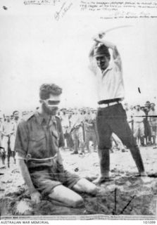 Aitape, New Guinea. 24 October 1943. A photograph found on the body of a dead Japanese soldier showing NX143314 Sergeant (Sgt) Leonard G. Siffleet of "M" Special Unit, wearing a blindfold and with ..