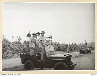WEWAK, NEW GUINEA. 1945-10-26. A CEREMONIAL PARADE AND MARCH PAST BY 6 DIVISION WAS INSPECTED BY GENERAL SIR THOMAS A. BLAMEY, COMMANDER-IN-CHIEF, ALLIED LAND FORCES, SOUTH WEST PACIFIC AREA, AT ..