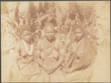 Three young women, one with a child on her back, Manus Island, Papua New Guinea, probably 1916