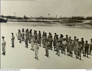 Cape Wom, Wewak, New Guinea. 1945-09-13. The Australian guard, awaiting the arrival of Lieutenant General Hatazo Adachi, General Officer Commanding XV111 Japanese Army, for the surrender ceremony