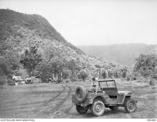 NANTAMBU, NEW BRITAIN. 1945-07-26. THE PIPER CUB LIGHT AIRCRAFT STRIP IN THE RANGES. AIR TRAVEL IS, AT THE MOMENT, THE ONLY MOVEMENT POSSIBLE FROM JACQUINOT BAY TO FORWARD AREAS