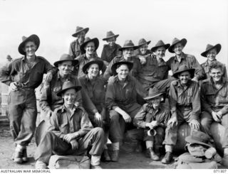 DUMPU, RAMU VALLEY, NEW GUINEA, 1944-03-21. MEMBERS OF THE 2/6TH CAVALRY COMMANDO SQUADRON PICTURED AT DUMPU AIRSTRIP HOMEWARD BOUND. THEY HAVE BEEN IN THE VALLEY SINCE THE BATTLE OF KAIAPIT EIGHT ..