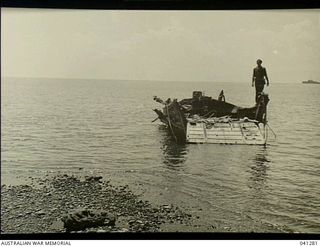 Milne Bay, Papua. 1943. Japanese invasion barge destroyed by fighter aircraft of the Royal Australian Air Force during the Japanese landing in 1942-08