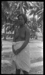 Young woman with village in background