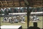 Official gathering including musicians with large panpipes, and british flag pennants