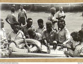 1944-01-26. AUSTRALIAN AND NEW GUINEA ADMINISTRATION UNIT NATIVES INSPECTING A NEW AMPHIBIOUS JEEP AT THE FACTORY OF THE FORD MOTOR COMPANY