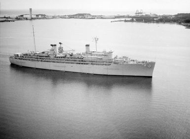 An elevated starboard view of the repair ship USS JASON (AR 8) entering the harbor