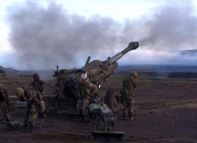 US Marines from 1ST Battalion, 12th Marines, Charlie Company, fire an M198 Howitzer during a training exercise at Pohakuloa Training Area on the Big Island of Hawaii