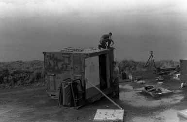 Members of Marine Air Control Squadron 2 (MACS-2) set up an AN/TPS-63 tactical surveillance radar system during Operation KERNAL BLITZ