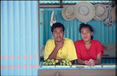 Two children behind counter