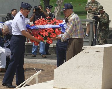 During a Wreath laying Ceremony at the National Memorial Cemetery of the Pacific, Honolulu, Hawaii Major General (MGEN), Thomas C. Waskow, USAF, Director of Air and Space Operations, Hickam AFB, HI and a original member of the Doolittle Raiders, place a wreath the War Memorial