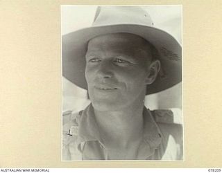 AITAPE, NEW GUINEA. 1945-01-08. NX122980 CAPTAIN A J MARSHALL, 2/2ND INFANTRY BATTALION. THE ONE ARMED OFFICER IN CHARGE OF "JOCK FORCE" (THE FORCE GETS ITS NAME FROM CAPTAIN MARSHALL, WHOSE ..