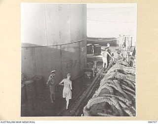 MIOS WUNDI, DUTCH NEW GUINEA. 1944-11-18. A WATER TANK BARGE ALONGSIDE HMAS BINGERA PROVIDING WATER