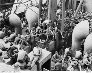 MEMBERS OF THE 2/4TH INFANTRY BATTALION, 19TH INFANTRY BRIGADE, ABOARD THE AMERICAN TROOPSHIP MEXICO WITH LITTLE SPACE TO STRETCH THEIR LEGS. THE MEN ARE BEING TRANSPORTED TO THE AITAPE OPERATIONAL ..
