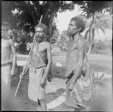 Policeman with two bush men, one holding a staff and the other carrying a bag, Salamaua, New Guinea, 1937, 3 / Sarah Chinnery