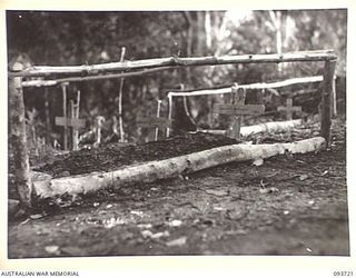 WEWAK AREA, NEW GUINEA, 1945-06-28. THE AIF CEMETERY IN THE FOOTHILLS OF MOUNT SHIBURANGU. MEMBERS OF C COMPANY, 2/8 INFANTRY BATTALION CAPTURED THE AREA AFTER HEAVY FIGHTING