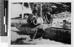 Two boys playing instruments on a canoe, Solomon Islands, Oceania, 1938