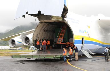 Earthquake ^ Tsunami ^ Typhoon - Pago Pago, American Samoa, October 13, 2009 -- Mark Ackerman (in navy blue shirt), Federal Emergency Management Agency Staging Area Manager, oversees the unloading of generators from the Antonov AN-225 cargo plane. The cargo plane is the largest in the world and carried generators contracted by the Federal Emergency Management Agency to assist the island with electrical power restoration. David Gonzalez/FEMA