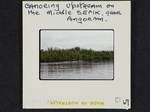 Men canoeing upstream on the Middle Sepik river, near Angoram, [Papua New Guinea, 1969?]