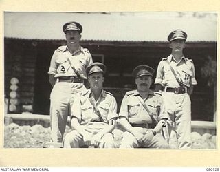 HERBERTON, QUEENSLAND, AUSTRALIA. 1944-09-11. OFFICERS OF THE ASSISTANT ADJUTANT AND QUARTERMASTER GENERAL BRANCH, HEADQUARTERS 6TH DIVISION. IDENTIFIED PERSONNEL ARE:- NX9157 MAJOR D.S.I. BURROWS ..