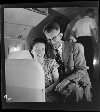 Qantas Empire Airways, Mr I Peters and Miss Nicholson, passengers on the Bird of Paradise service, en route to join the fisheries survey vessel, MV Fairwind, Port Moresby, Papua New Guinea