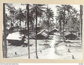 JACQUINOT BAY, NEW BRITAIN. 1945-06-09. THE LAYOUT OF HEADQUARTERS 5 BASE SUB-AREA OFFICE BUILDINGS. THE STAFF AND SERVICE BUILDINGS ARE IN THE FOREGROUND
