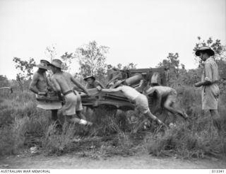 1942-10-05. A.I.F. ARTILLERY MEN RECENTLY RETURNED FROM THE MIDDLE EAST, ARE NOW MANNING 25-PDR, BATTERIES AGAINST THE JAPANESE IN NEW GUINEA. REPORTS INDICATE THAT THEIR OPERATIONS HAVE ..