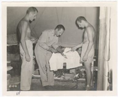 [Medics attending to serviceman, Saipan]