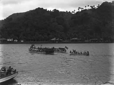 [Pacific island view with canoes]