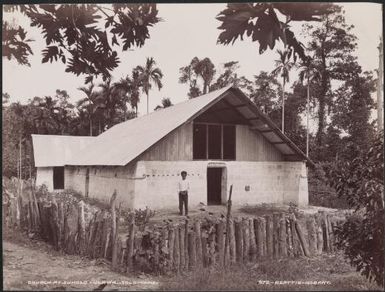 Man standing outside the church at Suholo, Ulawa, Solomon Islands, 1906 / J.W. Beattie