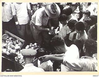 RABAUL AREA, NEW BRITAIN. 1945-09-13. CHINESE CIVILIANS, INTERNED BY THE JAPANESE AT A CAMP 15 MILES WEST OF RABAUL, WERE CONTACTED BY A PARTY OF AUSTRALIAN ARMY AND RED CROSS OFFICIALS SOON AFTER ..