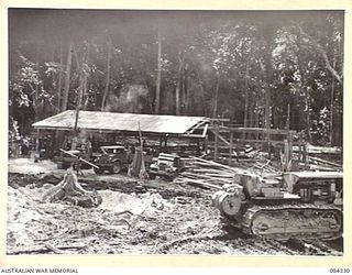 CAPE CUNNINGHAM, NEW BRITAIN, 1944-12-16. THE 2/2 FORESTRY COY SAWMILL LOCATED IN A HEAVILY TIMBERED AREA AT CAPE CUNNINGHAM NORTH