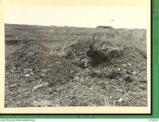 WANDOKAI, NEW GUINEA. 1944-04-18. THE EFFECTS OF 20 HITS FIRED FROM THE 3 INCH HOWITZER OF A MATILDA TANK AT A JAPANESE TYPE COCONUT LOG BUNKER (TYPE B). MEMBERS OF THE 1ST TANK BATTALION PROVIDED ..