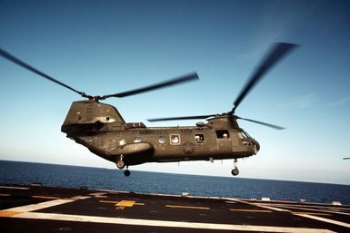 A CH-46E Sea Knight helicopter from Marine Medium Helicopter Squadron 261 takes off from the amphibious assault ship USS GUAM (LPH 9) while off the coast of Lebanon