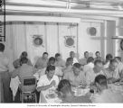 Dr. Lauren R. Donaldson and other Bikini Resurvey members at dinner in the wardroom aboard the USS CHILTON, summer 1947