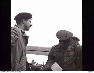 7 MILE, NEW GUINEA. 1943-11-01. THE ARRIVAL BY AIRCRAFT OF THE FIRST PARTY OF THE UNITED KINGDOM LETHBRIDGE MILITARY MISSION AT WARDS 'DROME. SHOWN: LIEUTENANT COLONEL (LT COL) R. B. READHEAD ..