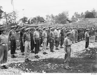 HELDSBACH MISSION, FINSCHHAFEN, NEW GUINEA. 1944-03-27. MEMBERS OF THE 2/3RD CASUALTY CLEARING STATION ON PARADE. IDENTIFIED PERSONNEL ARE: NX70377 CAPTAIN R. H. KAINES (1); VX15745 CAPTAIN W. ..