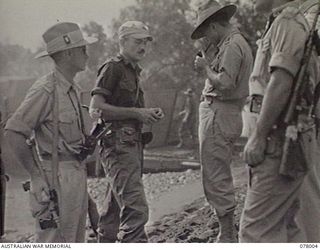 SAMPUN, NEW BRITAIN. 1944-12-27. LEFT TO RIGHT: VX63919 LIEUTENANT COLONEL W. B. MAGURIE, GENERAL STAFF OFFICER 1, 5TH DIVISION; NGX8 CAPTAIN B. FAIRFAX-ROSS, ALLIED INTELLIGENCE BUREAU AND NX27 ..