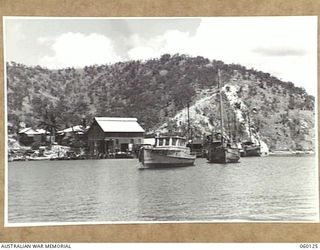 NAPA NAPA, NEW GUINEA. 1943-11-12. 2ND AUSTRALIAN WATERCRAFT WORKSHOPS, AUSTRALIAN ELECTRICAL AND MECHANICAL ENGINEERS, TAKEN FROM A VESSEL IN THE HARBOUR