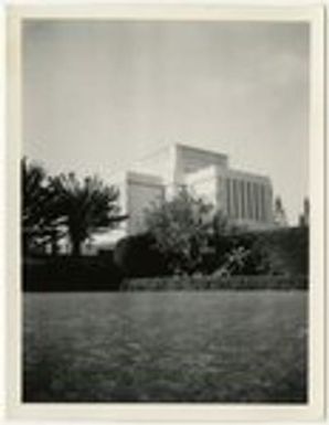 Grassy field and unidentified building