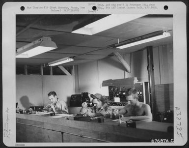 Delicate instruments are repaired by men of the 27th Air Depot Group at the Port Moresby Air Depot, Papua, New Guinea. 1943. (U.S. Air Force Number 67687AC)