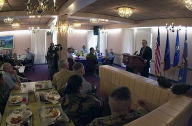 The Honorable Donald H. Rumsfeld, U.S. Secretary of Defense, speaks to troops at the Magellan Inn Dining facility during his visit to Andersen Air Force Base, Guam, during Exercise Cope North. U.S. Military members from all services attended the speech. (DoD photo by SENIOR AIRMAN Joshua Strang) (Released)