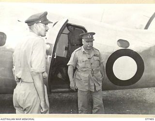 LAE AREA, NEW GUINEA. 1944-12-08. GENERAL SIR THOMAS BLAMEY, CBE, KCB, CMG, DSO, ED, COMMANDER-IN-CHIEF, ALLIED LAND FORCES, SOUTH WEST PACIFIC AREA, ALIGHTING FROM HIS LOCKHEED LODESTAR AIRCRAFT ..