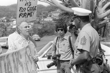 GUNNERY Sergeant (GYSGT) Mallery, Headquarters Service Battalion, Provost Marshal's Office, informs the anti-nuclear demonstrators that they are not authorized to enter the base