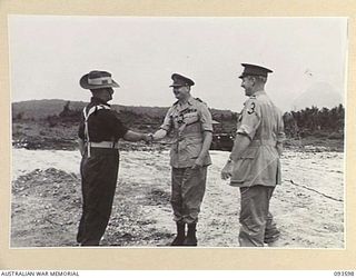 JACQUINOT BAY, NEW BRITAIN, 1945-07-01. BRIGADIER C.R.V. EDGAR, COMMANDER 4 INFANTRY BRIGADE (1), SHAKING HANDS WITH HIS ROYAL HIGHNESS, THE DUKE OF GLOUCESTER, GOVERNOR-GENERAL OF AUSTRALIA (2), ..