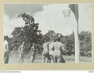 LAE, NEW GUINEA. 1944-11-11. CONVALESCING PATIENTS OF THE 112TH CONVALESCENT DEPOT ENGAGED IN A GAME OF BASKETBALL ON ONE OF THE UNIT COURTS. SEEN IS: NX91557 PRIVATE W.T. ROOTS, 112TH CONVALESCENT ..