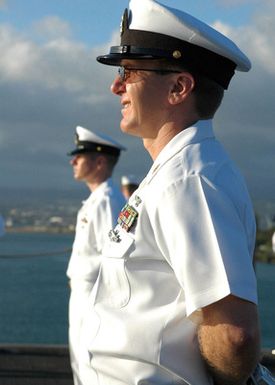 US Navy (USN) Sailors aboard the USN Nimitz Class Aircraft Carrier USS RONALD REAGAN (CVN 76) render honors to the USS ARIZONA Memorial as their ship arrives at Naval Station (NS) Pearl Harbor, Hawaii (HI) for a port visit. REAGAN and USN Carrier Air Wing 14 (CVW-14) are completing a deployment in support of the Global War On Terrorism (GWOT) and Maritime Security Operations (MSO) in the Pacific Ocean