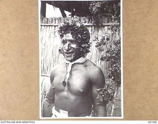 KILA KILA, NEW GUINEA. 1943-12-25. LABAU-UME, A MEMBER OF THE MEKEO TRIBE DRESSED IN HIS DANCE FINERY AT THE AUSTRALIAN AND NEW GUINEA ADMINISTRATION UNIT NATIVE LABOUR CAMP